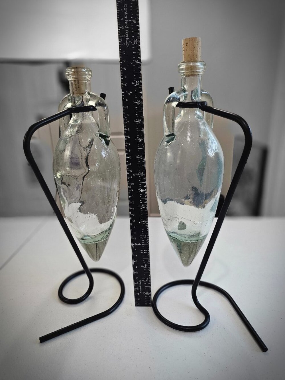 Vintage Pair Glass Hanging Bottle Vases with Black Metal Stands & Corks